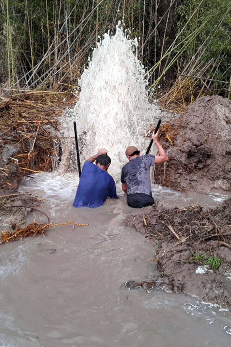 Workers repairing a leak.